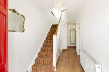 Reception hall with under stair storage and a shower room