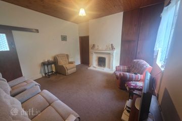 Spacious sitting room area with feature fireplace/electric fire