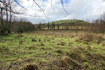 LAND ON LOWER SIDE OF THE ROAD 
