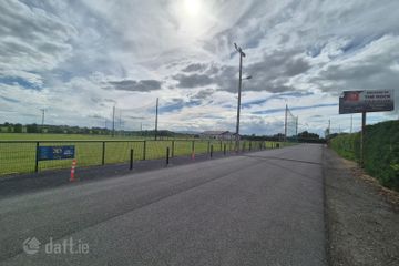 Adjacent to the Rock GAA Club.