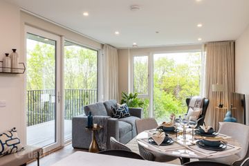 Spacious living room with floor-to-ceiling windows