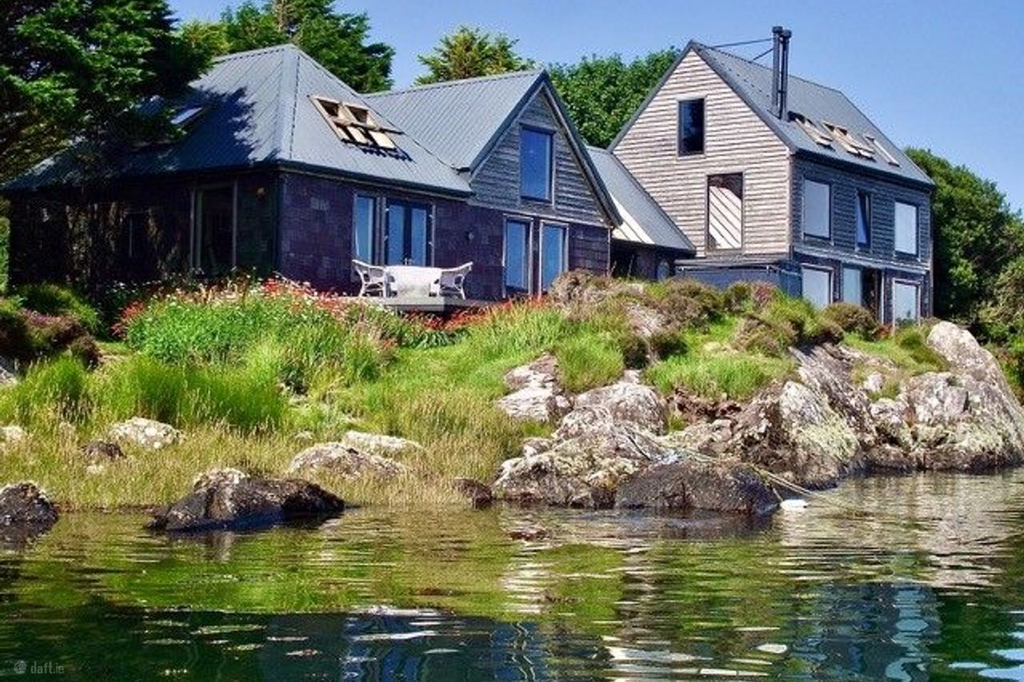View of home from West with sea and flowers
